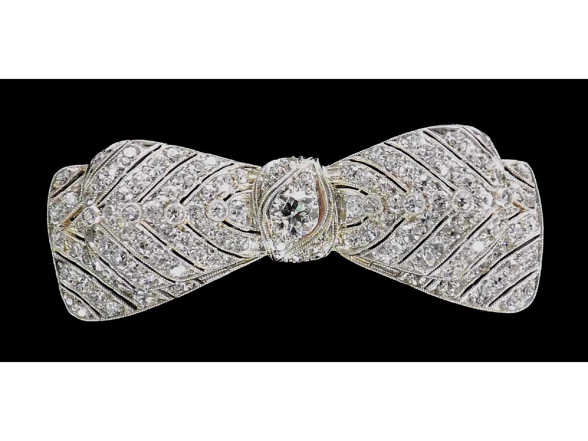 Appraisal: Good quality diamond bow brooch with round-cut diamonds in pierced