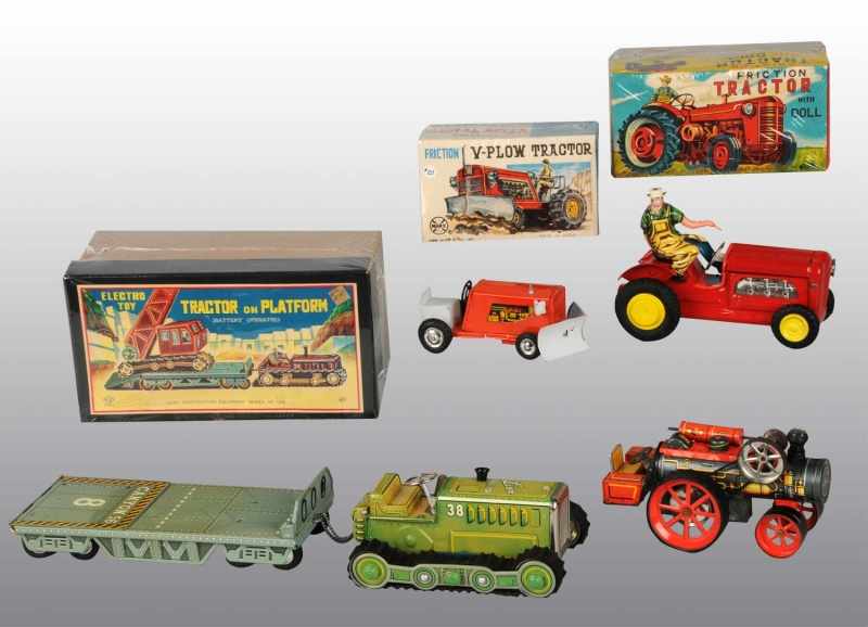 Appraisal: Lot of Tin Tractor Toys Description Japanese Working Includes one