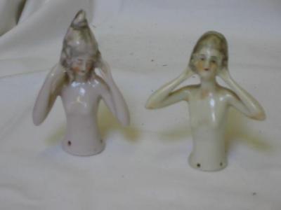 Appraisal: Two china pin cushion dolls with moulded hair and high