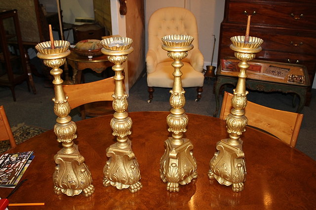 Appraisal: A SET OF FOUR ITALIANATE GILT TRIFORM CANDLESTICKS each with