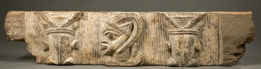 Appraisal: Nigerian wood lintel with animal heads A carved wood lintel