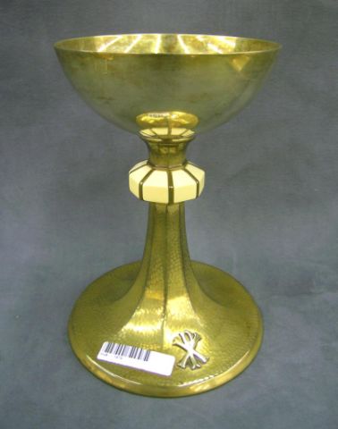 Appraisal: Hammered brass and ivory religious chalice