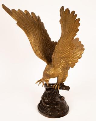 Appraisal: A brass sculpture of an eagle on a bronze branch