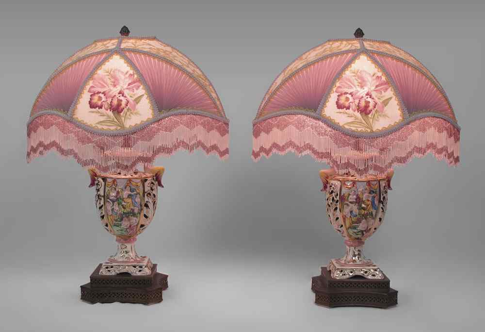 Appraisal: PAIR OF CAPO DE MONTE LAMPS WITH FRINGE SHADES Figural