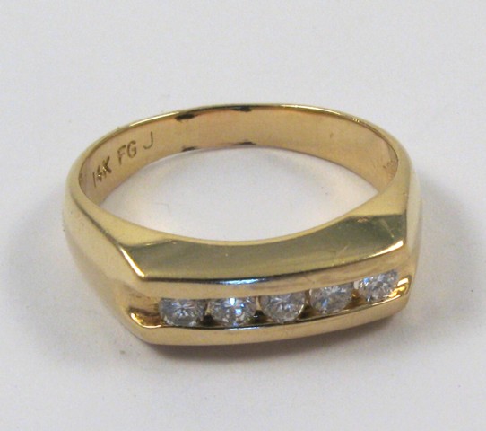 Appraisal: MAN'S DIAMOND AND FOURTEEN KARAT GOLD RING set with five