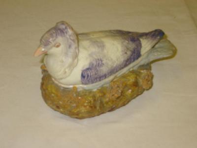 Appraisal: A PEARLWARE TUREEN modelled as a nesting dove painted in