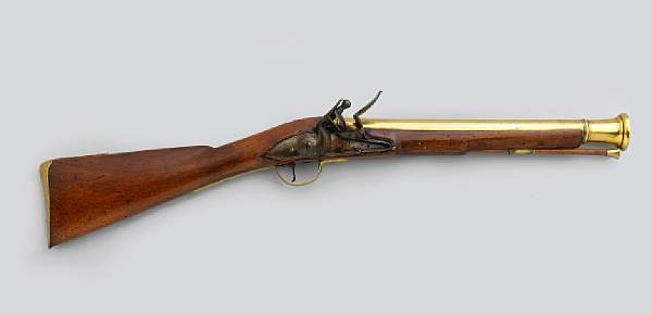 Appraisal: An English flintlock blunderbuss The inch brass cannon barrel with