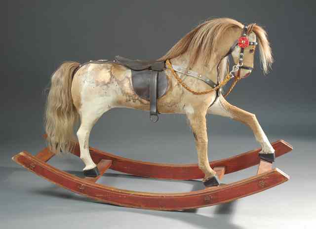 Appraisal: ROCKING HOBBY HORSE late th century of paper mache construction