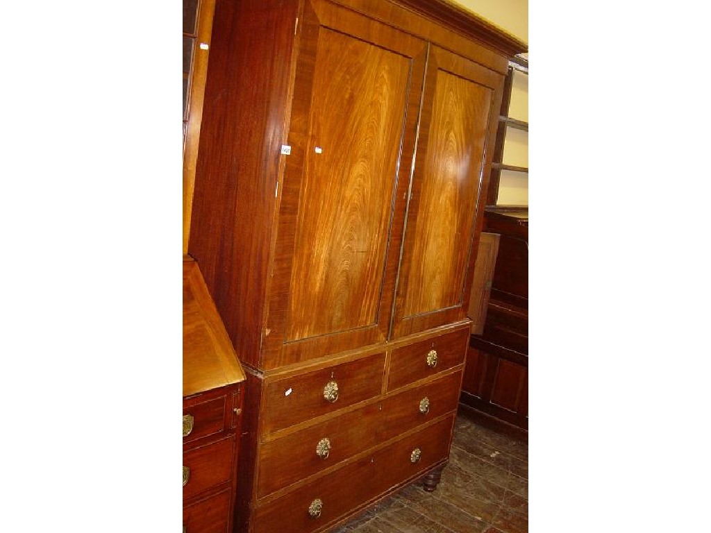 Appraisal: A th century mahogany linen press the upper section enclosed