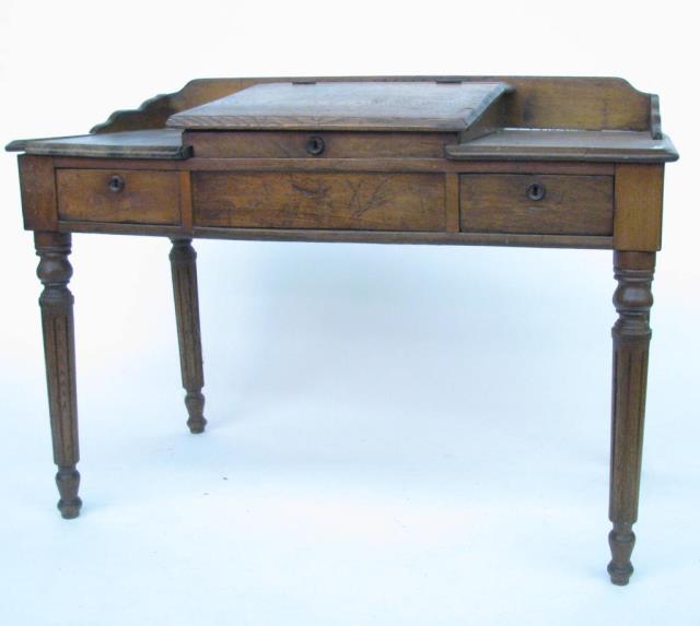 Appraisal: An antique schoolmaster's desk circa early th century chestnut oak