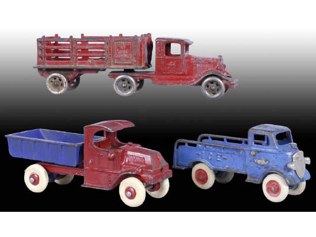 Appraisal: Lot of Cast Iron Work Truck Toys Description Champion red