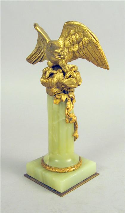 Appraisal: French gilt bronze figure of an eagle On a reeded