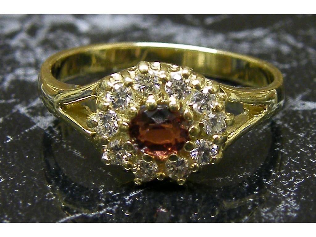 Appraisal: ct diamond and oval garnet cluster ring with split shoulders