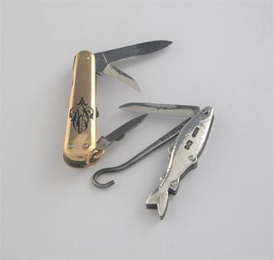 Appraisal: A gold mounted steel folding tool with knife blades prickers