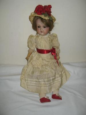 Appraisal: A German bisque head doll with brown sleeping eyes open