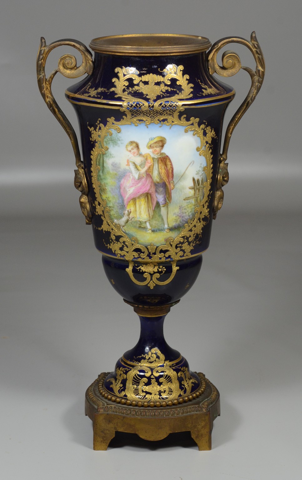 Appraisal: French porcelain Sevres style cobalt blue enameled vase front with