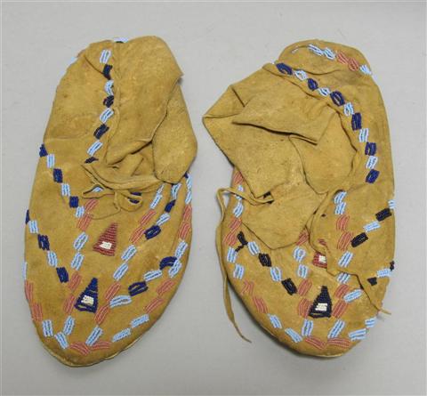 Appraisal: PAIR NATIVE AMERICAN BEADED HIDE MOCASSINS Purchased 's by Victor