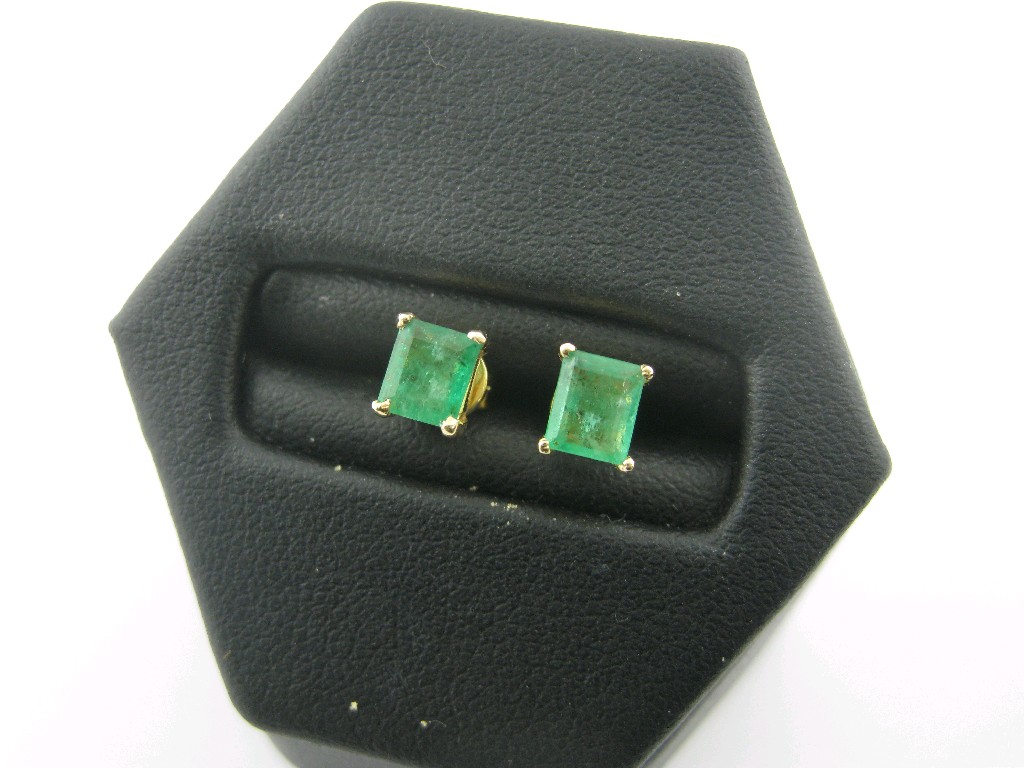 Appraisal: A pair of Emerald Ear Studs each claw-set single step-cut