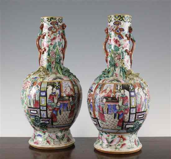 Appraisal: A pair of Chinese Canton decorated famille rose bottle vase