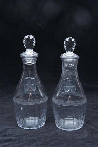 Appraisal: A PAIR OF ENGLISH GLASS DECANTERS with tasting stoppers the