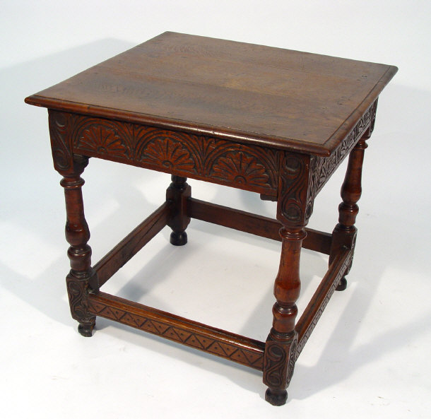 Appraisal: Square oak side table fitted with a floral carved frieze