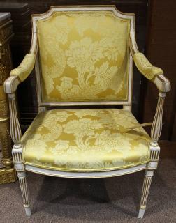 Appraisal: Neoclassical style paint decorated and parcel gilt yellow upholstered armchair