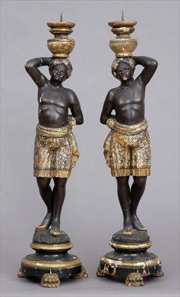 Appraisal: PAIR OF ITALIAN ROCOCO CARVED PAINTED AND PARCEL-GILT BLACKAMOOR CANDLESTICKS