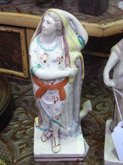 Appraisal: A PAIR OF GEORGE III PEARLWARE FIGURES of ladies in