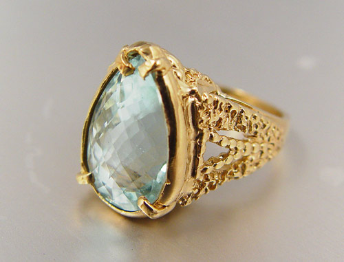 Appraisal: K yellow gold ring contains one pear shaped mixed cut