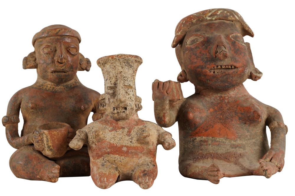 Appraisal: THREE PRIMITIVE CERAMIC FIGURESeach hollow molded with a hole in