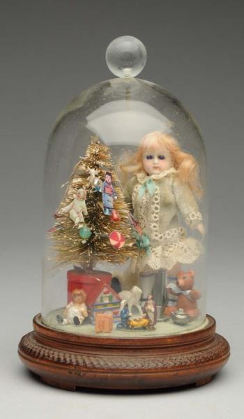 Appraisal: Antique Doll in Christmas Scene Small antique all-bisque with glass