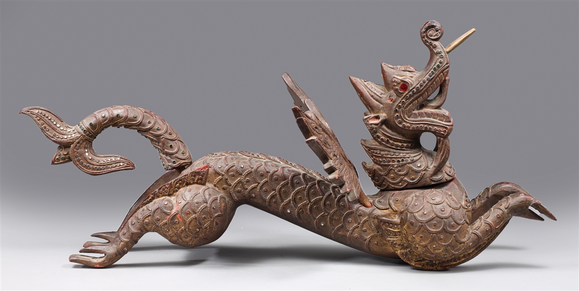 Appraisal: Vintage intricately carved Indonesian winged dragon sculpture with foil detail