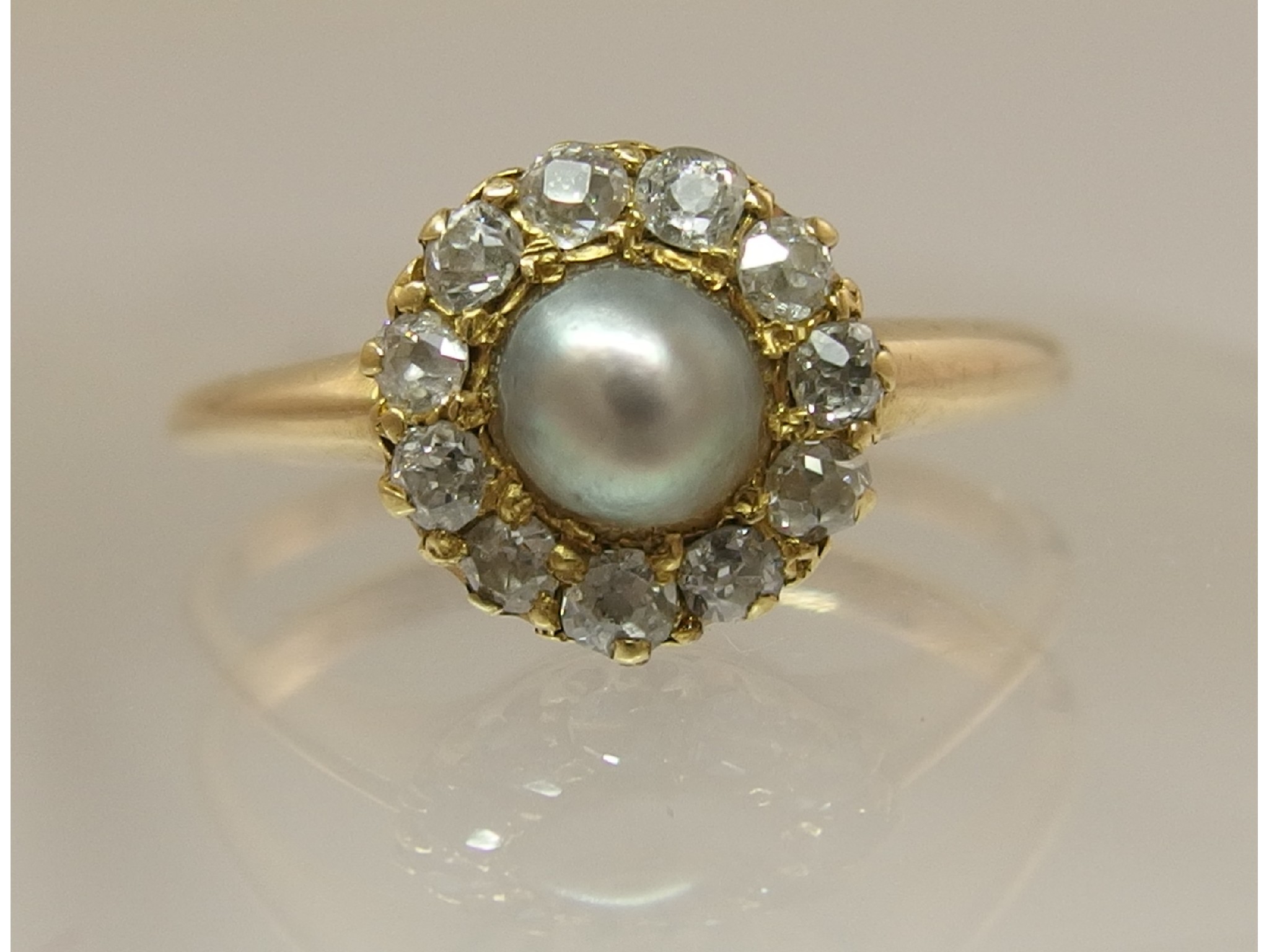 Appraisal: A ct yellow gold diamond and pearl ringthe dove grey