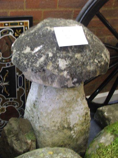 Appraisal: A SIMILAR STADDLE STONE high