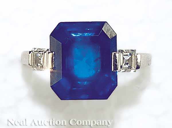 Appraisal: A Platinum and Octagonal Step-Cut Sapphire Ring with Baguette Diamond