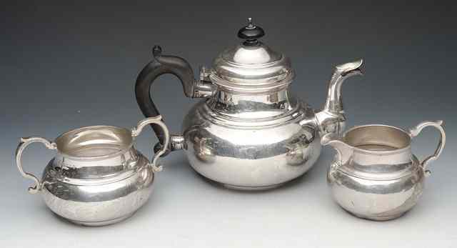 Appraisal: A GEORGE I STYLE THREE PIECE SILVER TEASET the ovoid