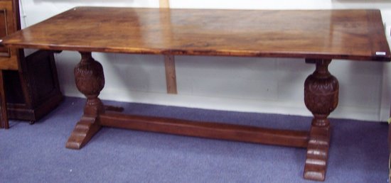 Appraisal: A rectangular fruitwood refectory type table on carved bulbous end