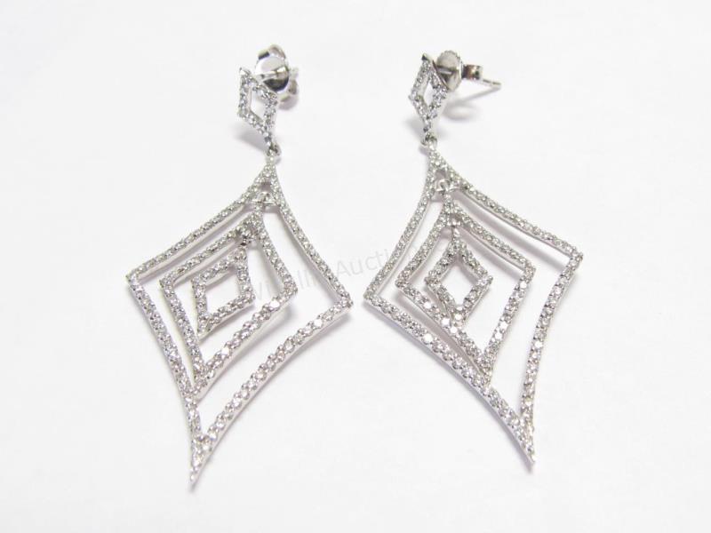 Appraisal: A pair of K white gold diamond dangle earrings long