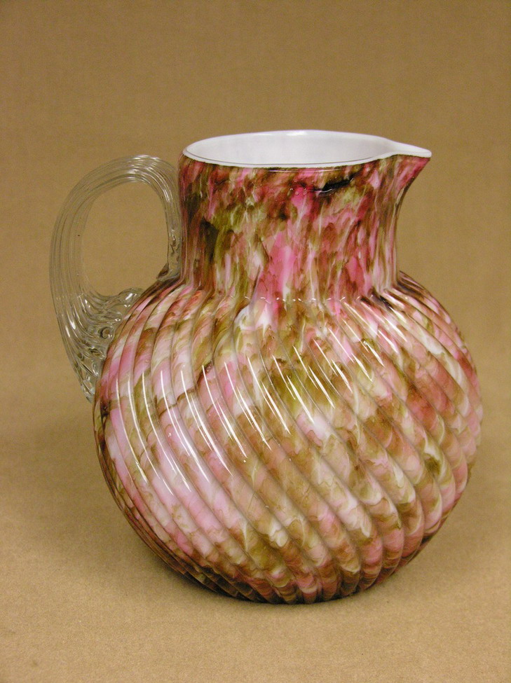 Appraisal: SPATTER AND SPANGLE PITCHER swirled rib exterior white interior applied