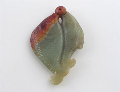 Appraisal: A Chinese jade carving of two fish embracing a pearl