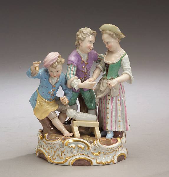 Appraisal: A Meissen porcelain figural group of three children second half