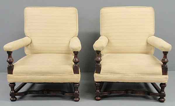 Appraisal: Pair of William Mary style mahogany club chairs with stretcher