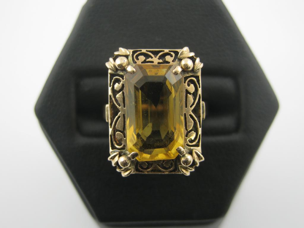 Appraisal: A gold Topaz single stone Ring the large step-cut stone