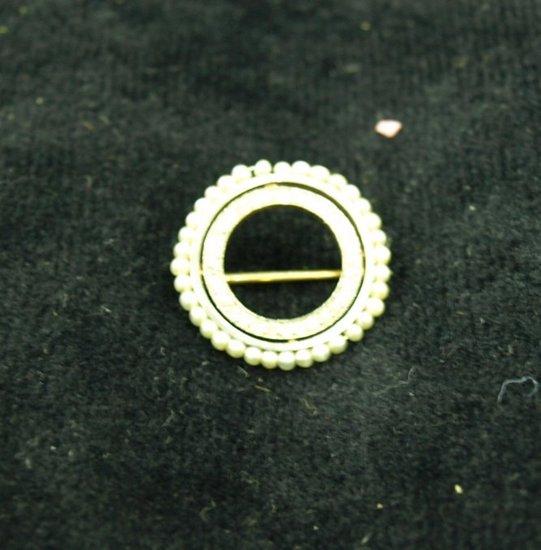 Appraisal: A pearl and diamond brooch of circular form the inner