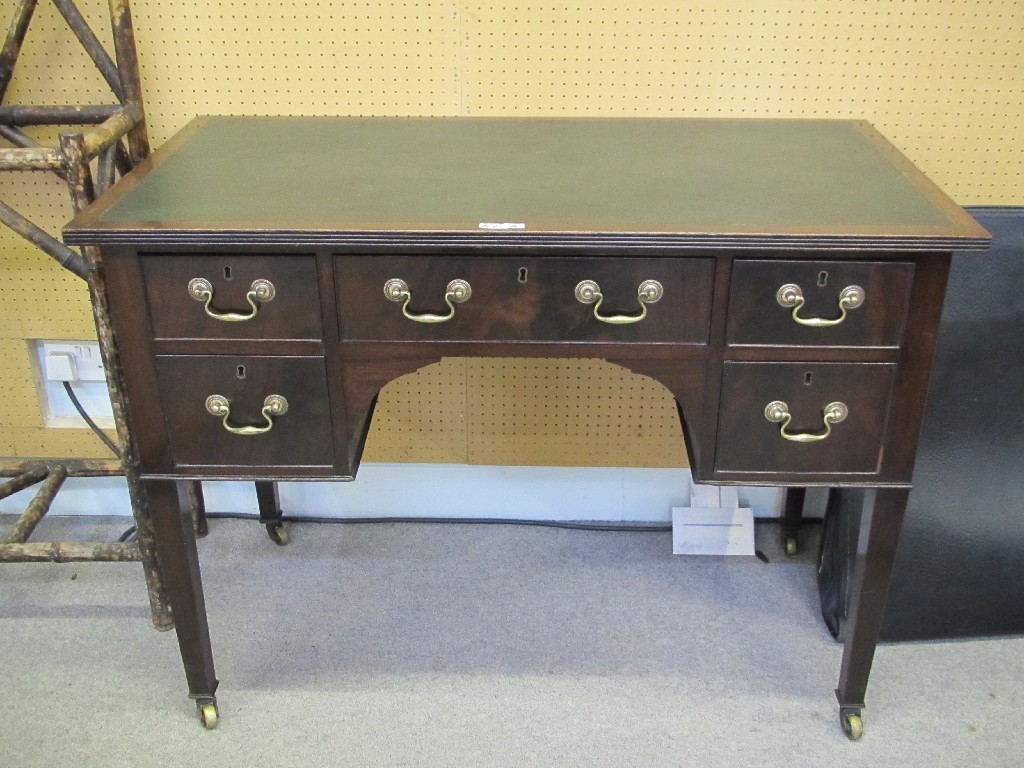 Appraisal: Edwardian mahogany kneehole desk with leather top