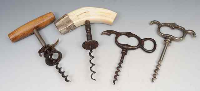 Appraisal: A TUSK HANDLED CORKSCREW with a wire worm and button