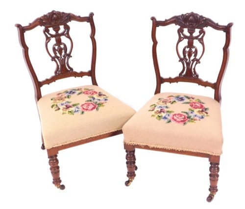 Appraisal: Two Victorian walnut nursing chairs with tapestry seats