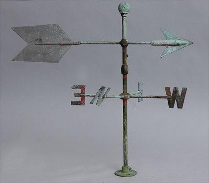 Appraisal: AMERICAN METAL ARROW-FORM WEATHERVANE The pointed cross bar on swivel