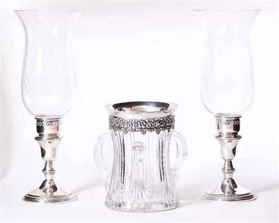 Appraisal: American sterling-mounted vase and candlesticks with hurricane shades ornate silver-mounted