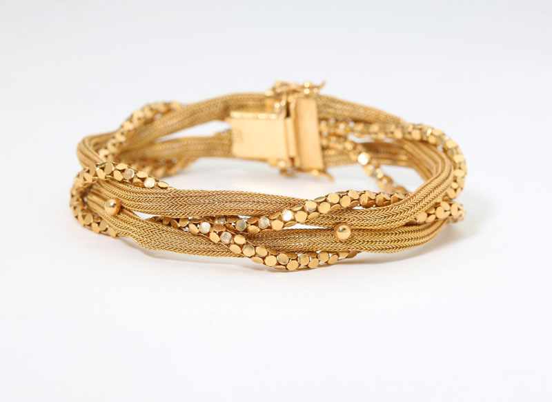 Appraisal: K yellow gold weave and chain braided bracelet '' gms